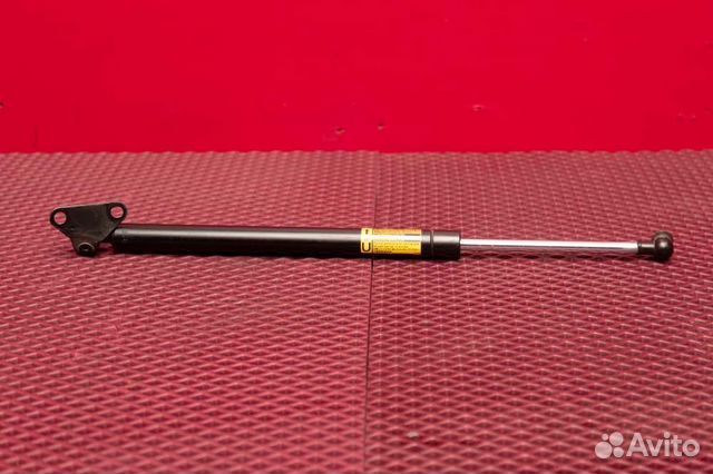 Амортизатор крышки багажника правый Toyota Land